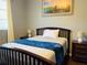 Cozy bedroom with a double bed and plenty of natural light at 8 Sportsman Ter, Rotonda West, FL 33947