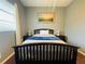 Bright bedroom with a double bed and wood flooring at 8 Sportsman Ter, Rotonda West, FL 33947
