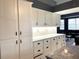 Modern kitchen featuring white shaker cabinets and granite at 8 Sportsman Ter, Rotonda West, FL 33947