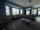Living room with bay windows and comfortable seating at 8 Sportsman Ter, Rotonda West, FL 33947