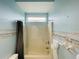 Full bathroom with tub/shower and gray shower curtain at 8 Sportsman Ter, Rotonda West, FL 33947