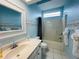 Clean bathroom with shower/tub combo and beach-themed decor at 8 Sportsman Ter, Rotonda West, FL 33947