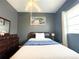 Well-lit bedroom with a double bed and built-in dresser at 8 Sportsman Ter, Rotonda West, FL 33947