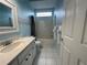 Clean bathroom with shower/tub combo and white vanity at 8 Sportsman Ter, Rotonda West, FL 33947