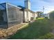 Large backyard with a screened enclosure and plenty of space for outdoor activities at 8 Sportsman Ter, Rotonda West, FL 33947