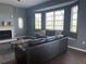 Living room with bay windows and comfortable seating at 8 Sportsman Ter, Rotonda West, FL 33947
