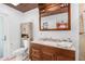 Bathroom with granite countertop and wooden vanity at 1361 Newton St, Port Charlotte, FL 33952