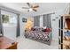 Cozy bedroom with daybed, gray curtains, and light wood flooring at 1361 Newton St, Port Charlotte, FL 33952