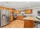Spacious kitchen with wood cabinets, stainless steel appliances, and tile flooring at 1361 Newton St, Port Charlotte, FL 33952