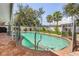 Relaxing kidney-shaped pool with brick pavers and safety fence at 1361 Newton St, Port Charlotte, FL 33952