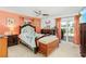 Bedroom with a queen-size bed, and sliding door to patio at 1361 Newton St, Port Charlotte, FL 33952