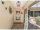 Inviting entryway with a welcome sign and tropical decor at 1361 Newton St, Port Charlotte, FL 33952