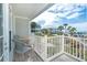 Private balcony with table and chairs, offering partial ocean view at 7536 Palm Island S Dr # 1511, Placida, FL 33946