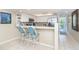 Well-equipped kitchen with breakfast bar and modern appliances at 7536 Palm Island S Dr # 1511, Placida, FL 33946
