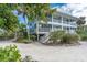 Two-story beach house with private balconies and lush landscaping at 7536 Palm Island S Dr # 1511, Placida, FL 33946