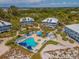Aerial view showing community pool, beach access, and homes at 7536 Palm Island S Dr # 1511, Placida, FL 33946