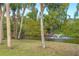 Peaceful canal view with lush vegetation and a water fountain feature at 7536 Palm Island S Dr # 1511, Placida, FL 33946