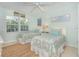 Guest bedroom with two twin beds and beach decor at 7536 Palm Island S Dr # 1511, Placida, FL 33946