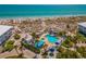 Aerial view of community pool, spa, and beach access at 7536 Palm Island S Dr # 1511, Placida, FL 33946