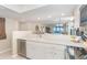Updated kitchen with stainless steel appliances and white cabinetry at 7536 Palm Island S Dr # 1511, Placida, FL 33946