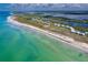 Aerial view of beachfront property with clear water and white sand at 7454 Palm Island Dr # 3313, Placida, FL 33946