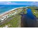 Aerial view of coastal community showing beach access and resort amenities at 7454 Palm Island Dr # 3313, Placida, FL 33946