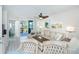Living room with comfy seating, balcony access, and coastal decor at 7454 Palm Island Dr # 3313, Placida, FL 33946