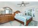 Bedroom with wooden bed frame and ocean view at 7454 Palm Island Dr # 3313, Placida, FL 33946
