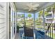 Screened porch with ocean view and comfortable seating at 7454 Palm Island Dr # 3313, Placida, FL 33946