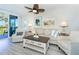 Relaxing living room with sofa, chairs, and ocean view at 7454 Palm Island Dr # 3313, Placida, FL 33946