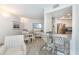 Bright dining area with table and chairs, adjacent to kitchen at 7454 Palm Island Dr # 3313, Placida, FL 33946