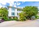 Two-story building with balconies and golf carts at 7454 Palm Island Dr # 3313, Placida, FL 33946