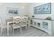 Dining area with table, chairs, and a storage cabinet at 7454 Palm Island Dr # 3313, Placida, FL 33946