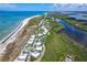 Aerial showing community near beach with tennis court and pool at 7454 Palm Island Dr # 3313, Placida, FL 33946