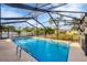 Sparkling screened pool in backyard at 3081 Pellam Blvd, Port Charlotte, FL 33948