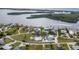 Serene waterfront community showcases a collection of beautiful homes along winding canals and lush landscaping at 342 Green Dolphin Dr, Placida, FL 33946