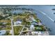 Beautiful coastal neighborhood with waterfront properties, docks, and scenic water views from above at 342 Green Dolphin Dr, Placida, FL 33946