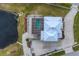Aerial view of home featuring a screened pool and patio overlooking a pond at 342 Green Dolphin Dr, Placida, FL 33946