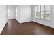 Bright and airy bedroom with wood-look tile flooring, natural light, and plantation shutters at 342 Green Dolphin Dr, Placida, FL 33946