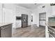Bright kitchen features white cabinetry, stainless steel appliances, and granite countertops, modern tile flooring at 342 Green Dolphin Dr, Placida, FL 33946