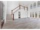 Expansive living space with wood staircase, tile flooring, soaring ceilings, and natural light at 342 Green Dolphin Dr, Placida, FL 33946