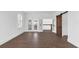 Bright, airy living space features wood-look tile floors, access to balcony and additional living spaces at 342 Green Dolphin Dr, Placida, FL 33946