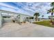 Outdoor kitchen featuring built-in grill station with prep areas and bar top seating at 342 Green Dolphin Dr, Placida, FL 33946