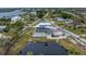 Aerial view of house, private pond, and surrounding neighborhood at 342 Green Dolphin Dr, Placida, FL 33946