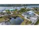Aerial view of waterfront property with private pond and lush landscaping at 342 Green Dolphin Dr, Placida, FL 33946