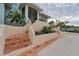 Inviting home exterior with terracotta tile stairs and landscaping at 342 Green Dolphin Dr, Placida, FL 33946