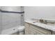 Bathroom with marble vanity, shower, and toilet at 8099 Walbert St, Port Charlotte, FL 33981