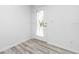 Bright entryway with wood-look flooring and white walls at 8099 Walbert St, Port Charlotte, FL 33981