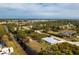 Aerial view showcasing home's location and neighborhood at 8099 Walbert St, Port Charlotte, FL 33981