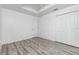 Bright bedroom with wood-look floors and double door closet at 8099 Walbert St, Port Charlotte, FL 33981